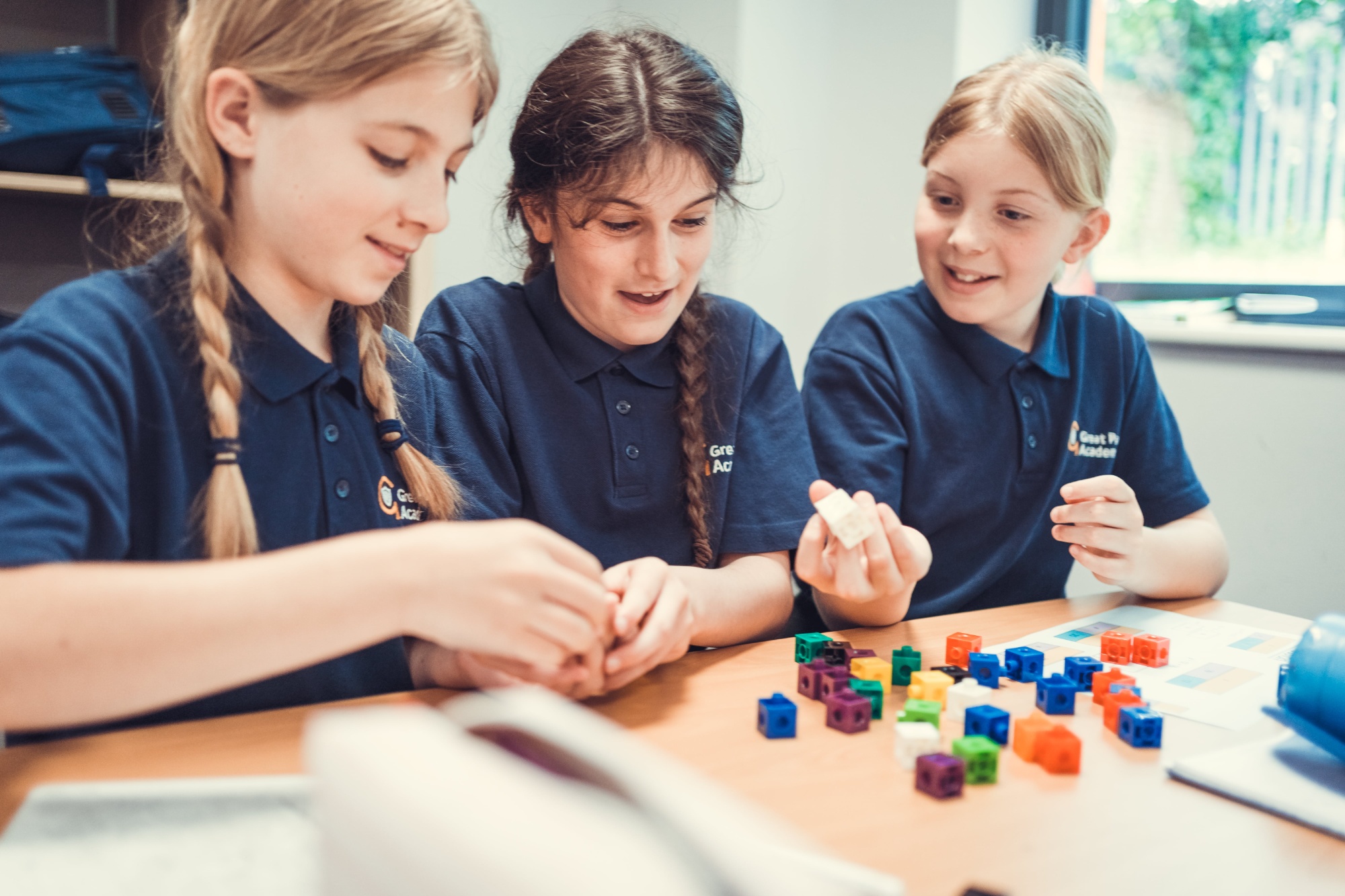 Children playing together with bricks